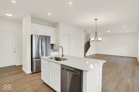 Kitchen at 1353 Mahoning Road, Sheridan, IN — Bright modern kitchen with stainless appliances and island.