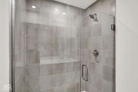Primary bathroom at 1353 Mahoning Road, Sheridan, IN — Luxurious spa-like walk-in shower with rainfall head.