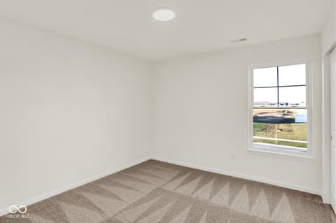 Bedroom at 1353 Mahoning Road, Sheridan, IN — Bright bedroom with expansive rural views and natural light.