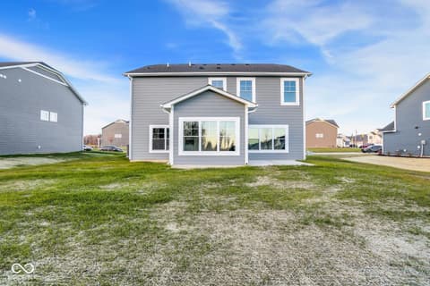 Front exterior at 1353 Mahoning Road, Sheridan, IN — Bright two-story home with expansive front windows.