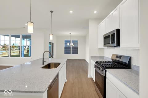Kitchen at 19773 Highclere Lane, Sheridan, IN — Bright modern kitchen with premium finishes and island.