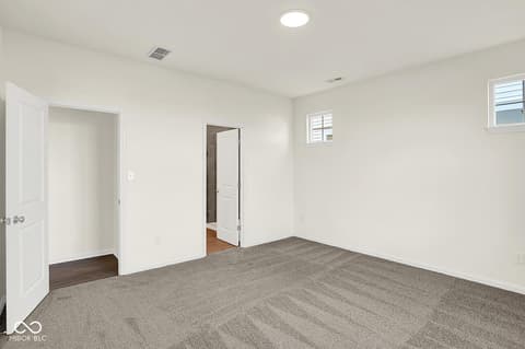 Bedroom at 19773 Highclere Lane, Sheridan, IN — Bright, spacious bedroom with multiple closets.