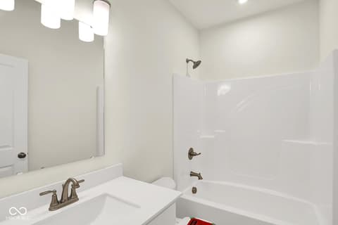 Primary bathroom at 19773 Highclere Lane, Sheridan, IN — Bright, clean bathroom with modern fixtures and finishes.