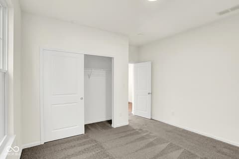 Primary bedroom at 19773 Highclere Lane, Sheridan, IN — Spacious primary bedroom with generous walk-in closet.