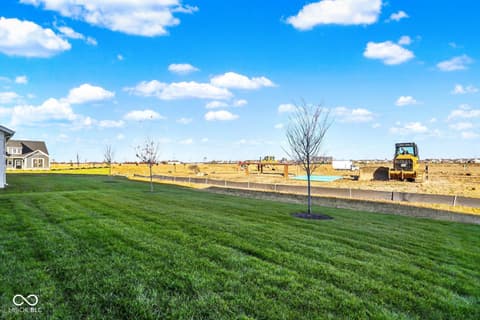 Yard at 19773 Highclere Lane, Sheridan, IN — Spacious new lot with mature landscaping and open views.
