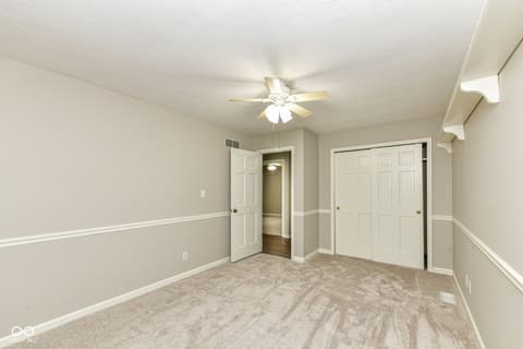 Bedroom at 13035 Wembly Road, Carmel, IN — Spacious bedroom with double closets and neutral décor.