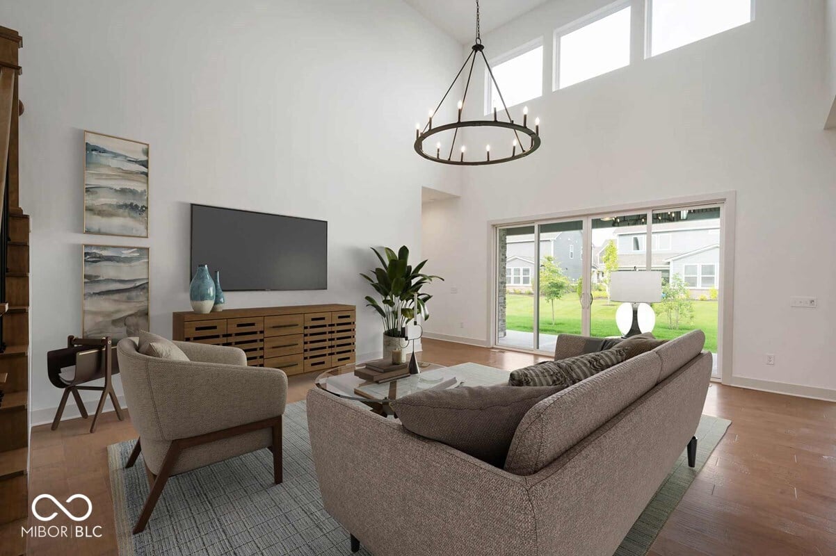 Bright modern living room with vaulted ceilings and natural light.