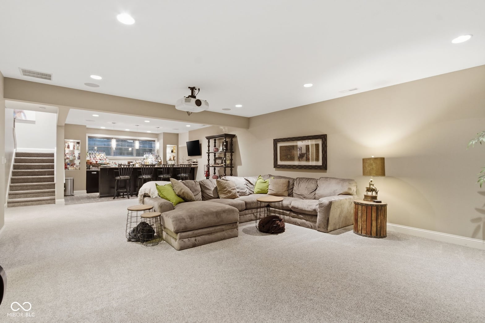 Spacious family room with open layout and wet bar.