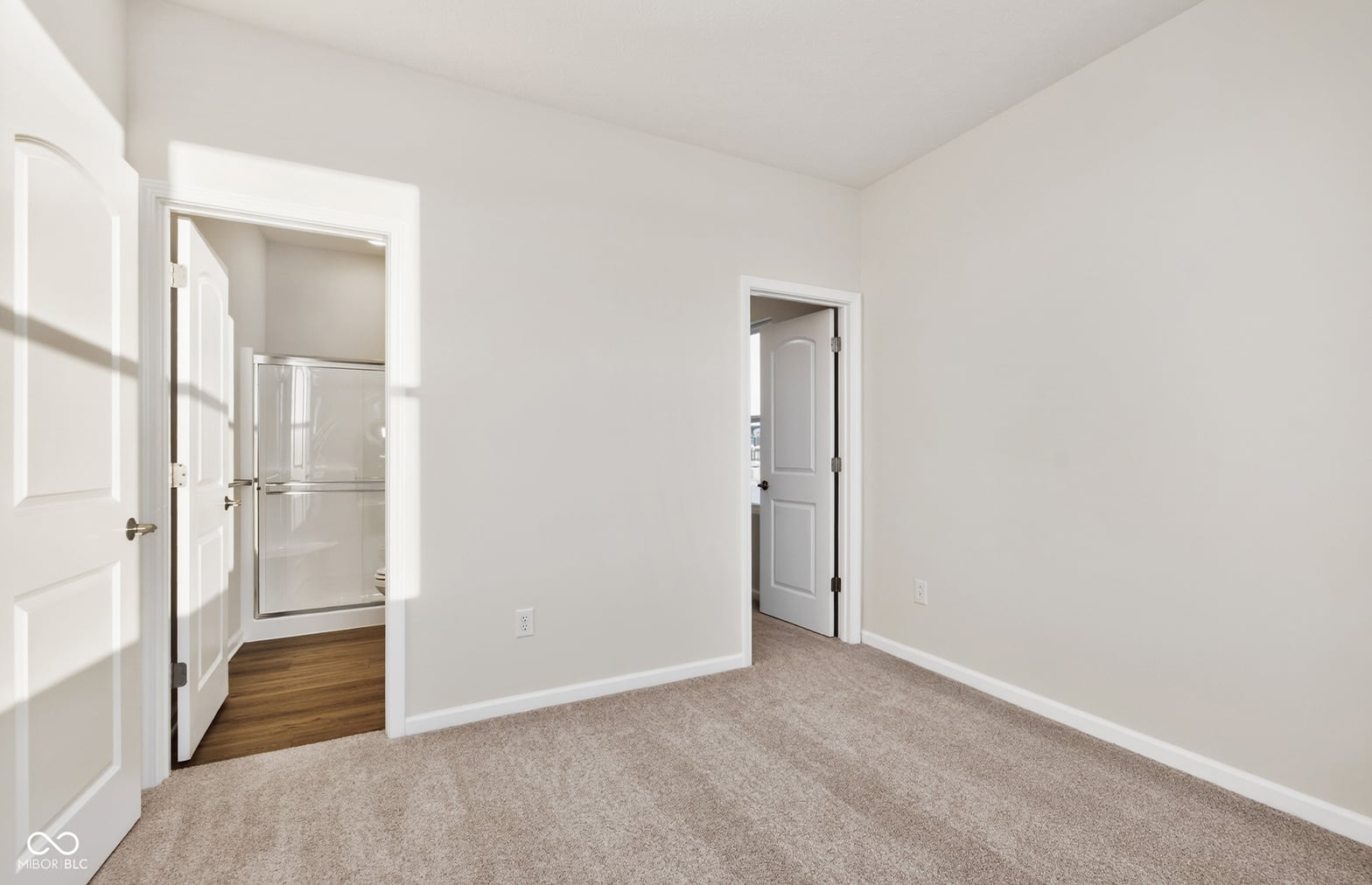 Bright primary suite with ensuite bathroom access.