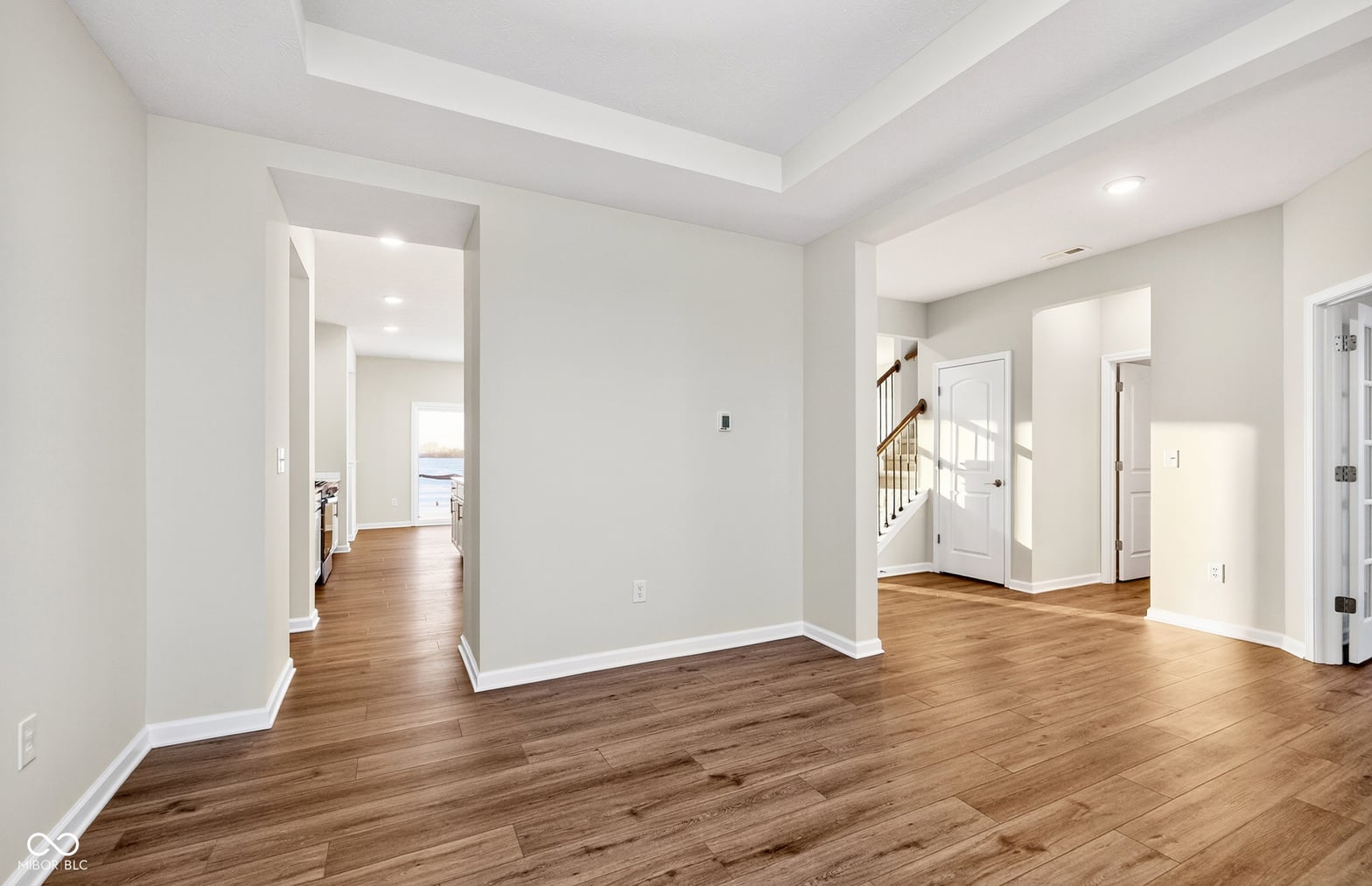 Bright, spacious family room with coffered ceiling details.