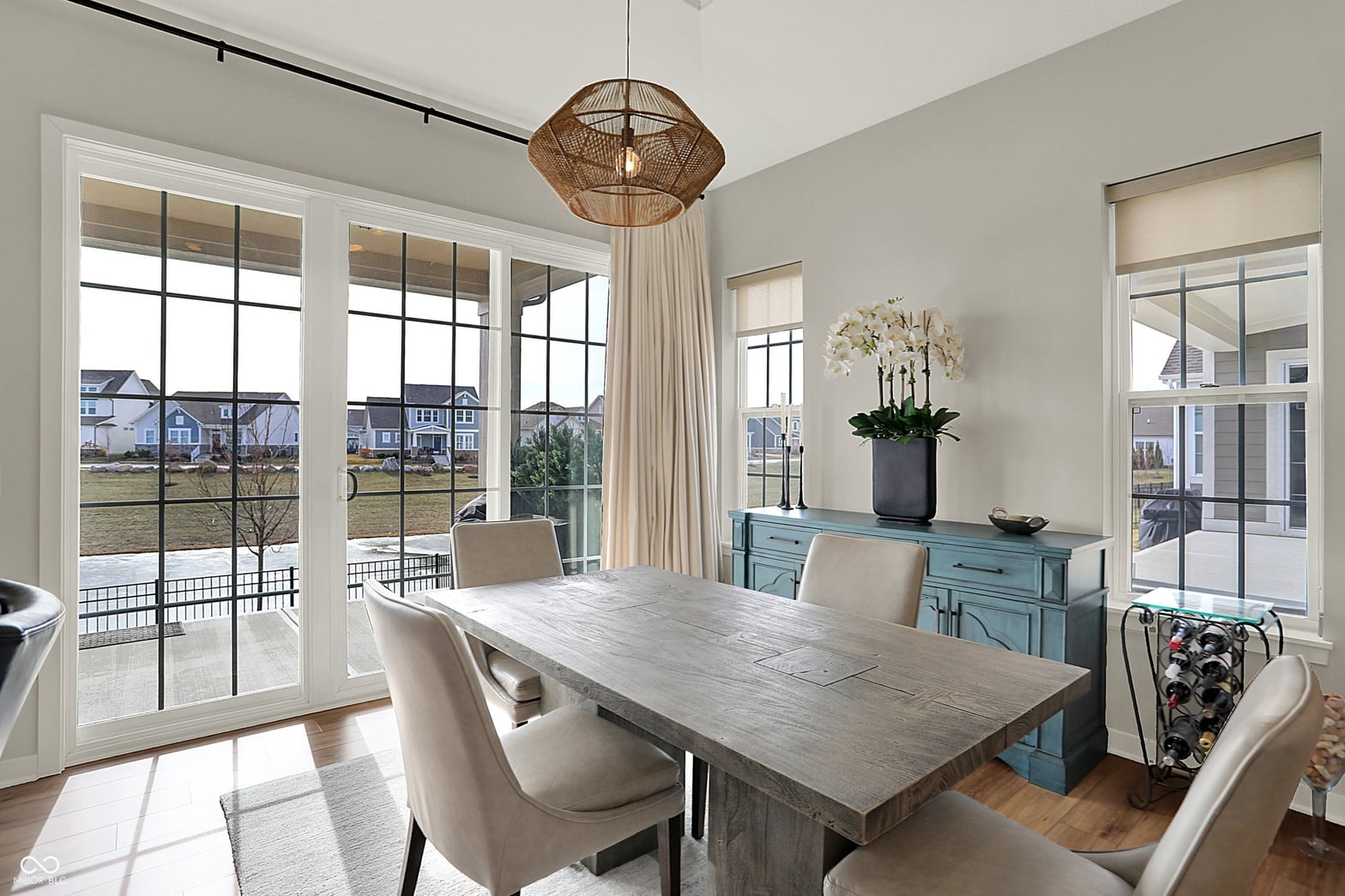 Bright contemporary dining with expansive views and patio access.