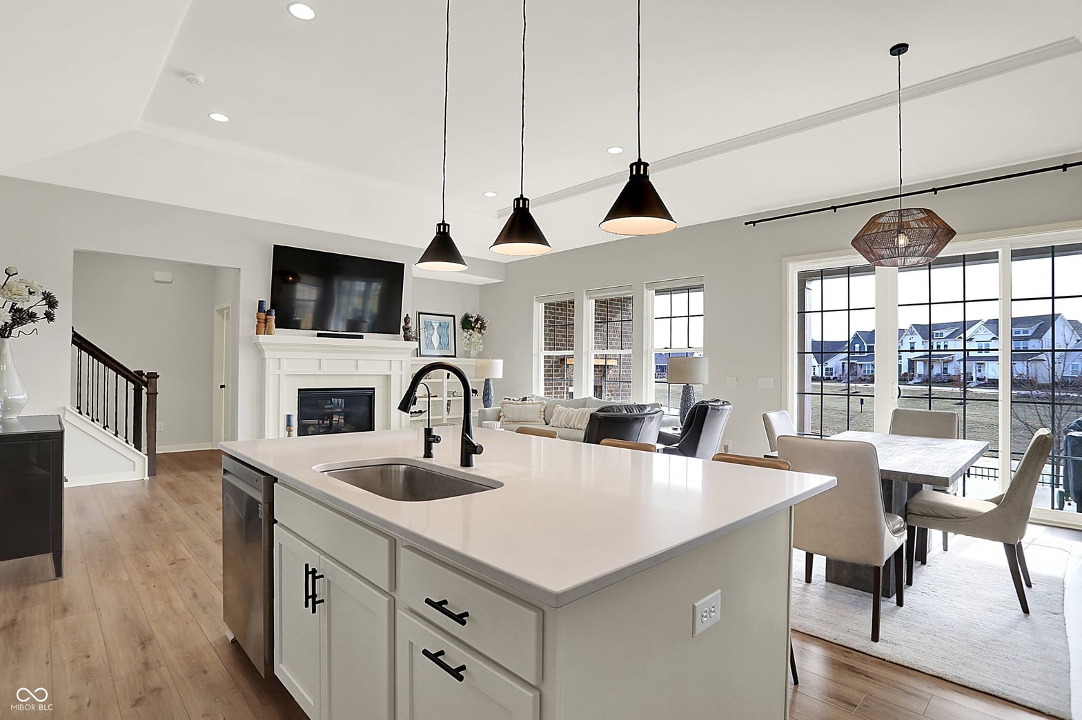 Bright open-concept kitchen with island and abundant natural light.