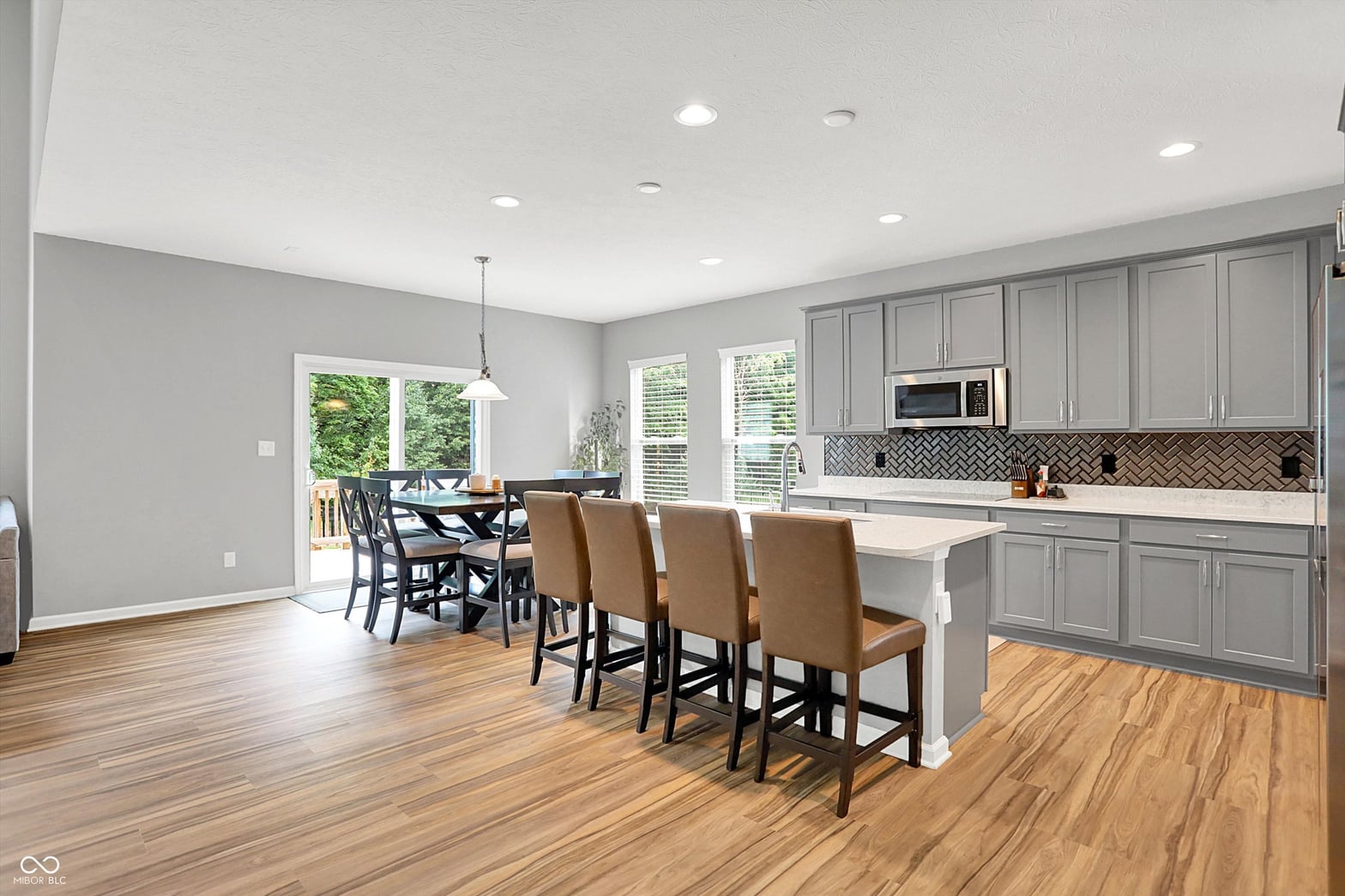 Bright, modern kitchen with island and outdoor access.