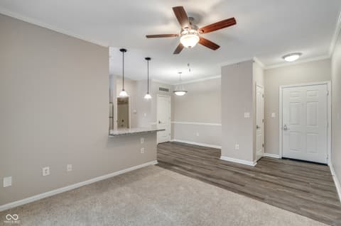 Living room at 12926 University Crescent, Carmel, IN — Bright, modern open-concept space with quality finishes.