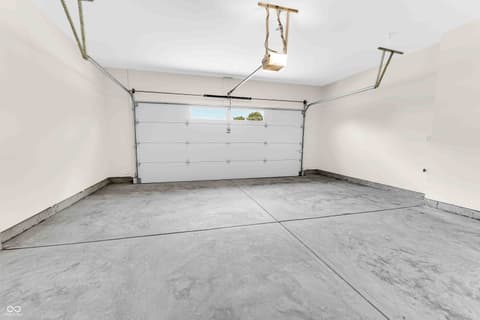 Garage at 5866 Harbour Town Drive, Noblesville, IN — Clean, spacious garage with modern overhead door system.