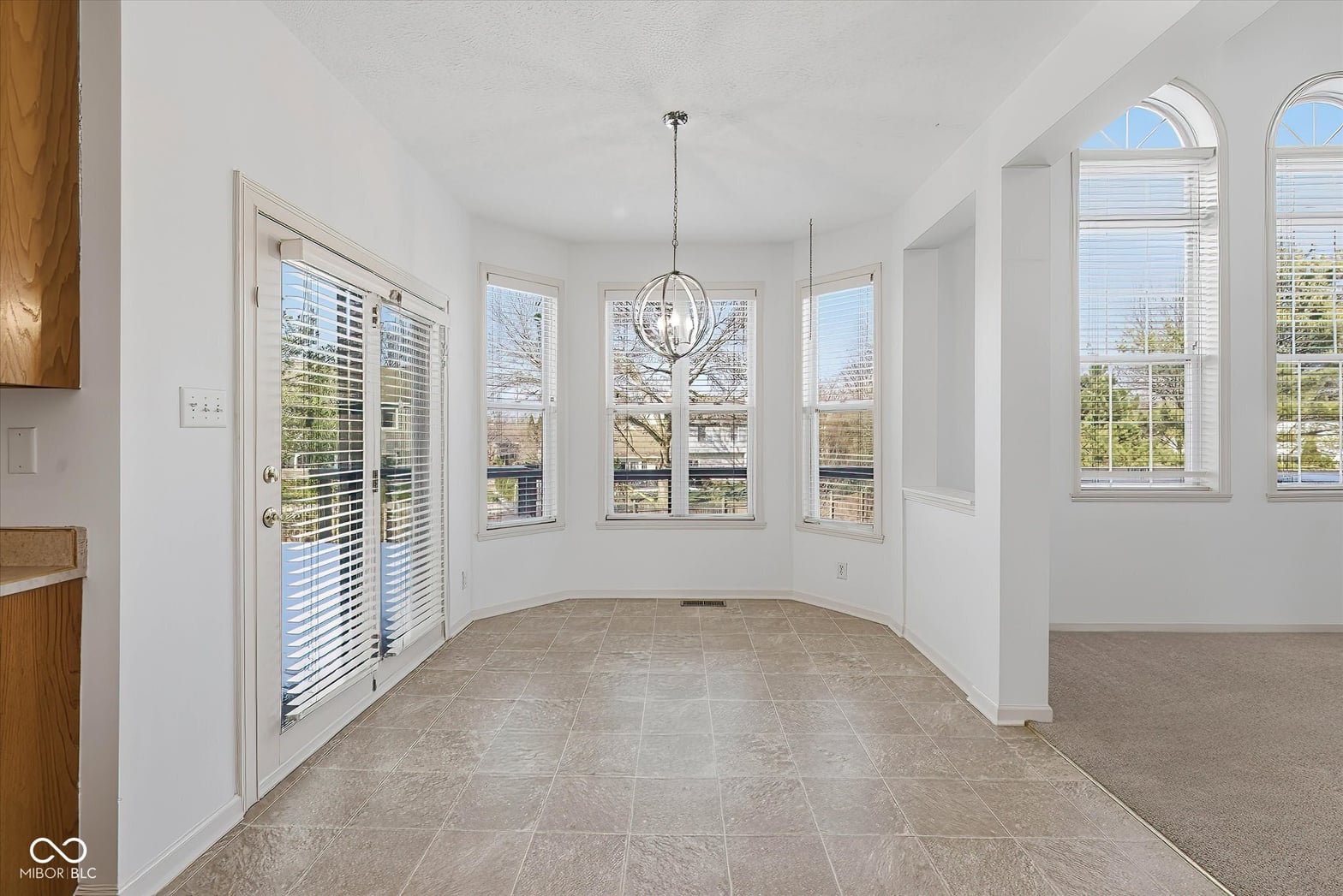 Bright, airy room with abundant windows and natural light.