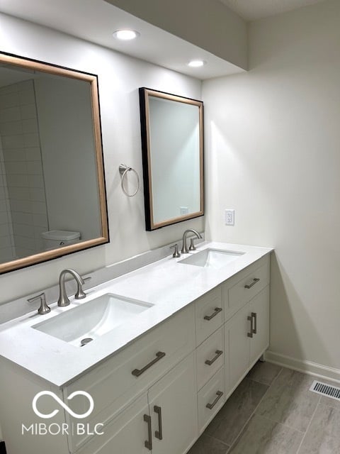 Luxurious spa-like primary bath with double vanity.