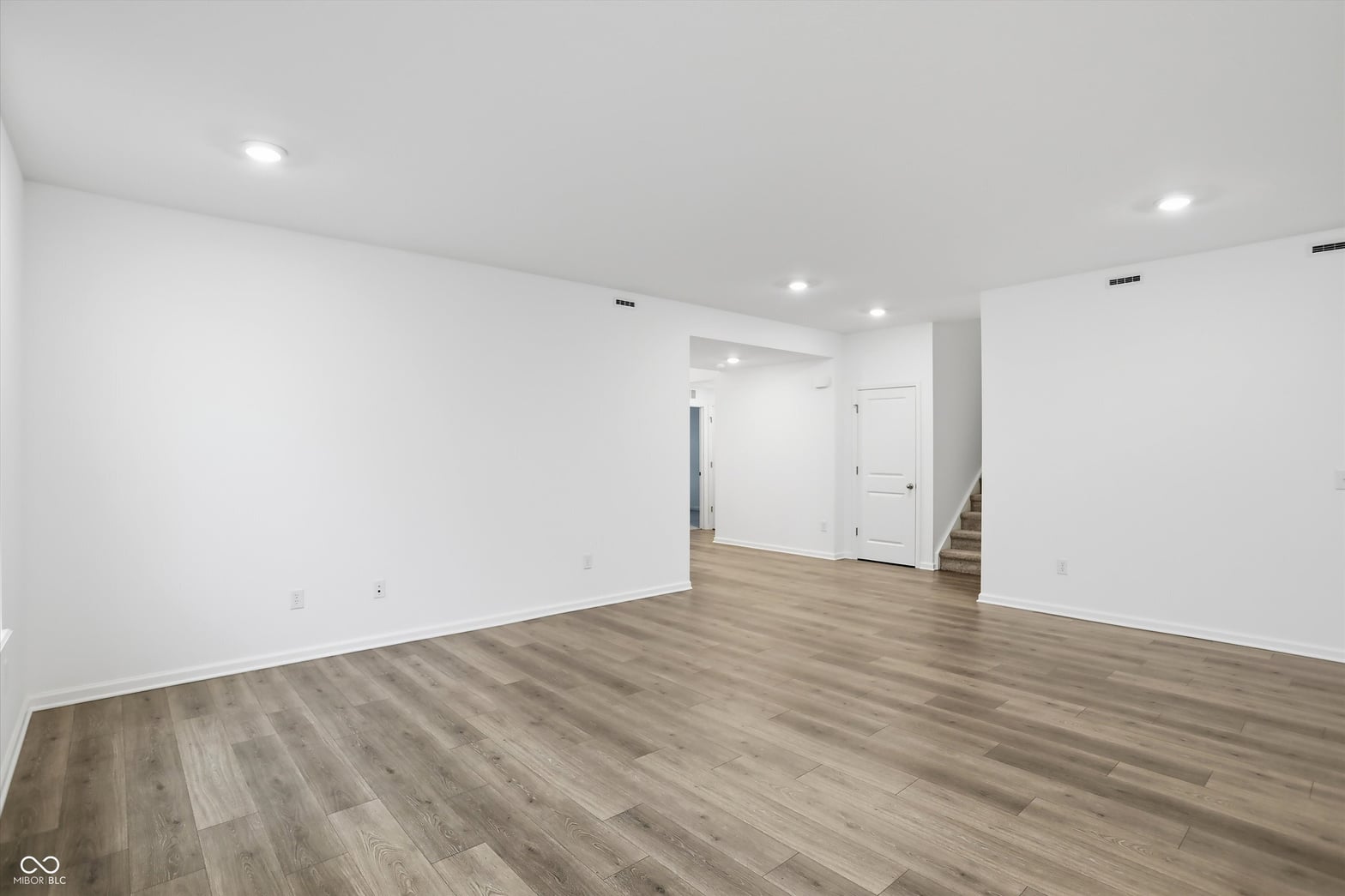 Bright, open basement with modern finishes and quality flooring.