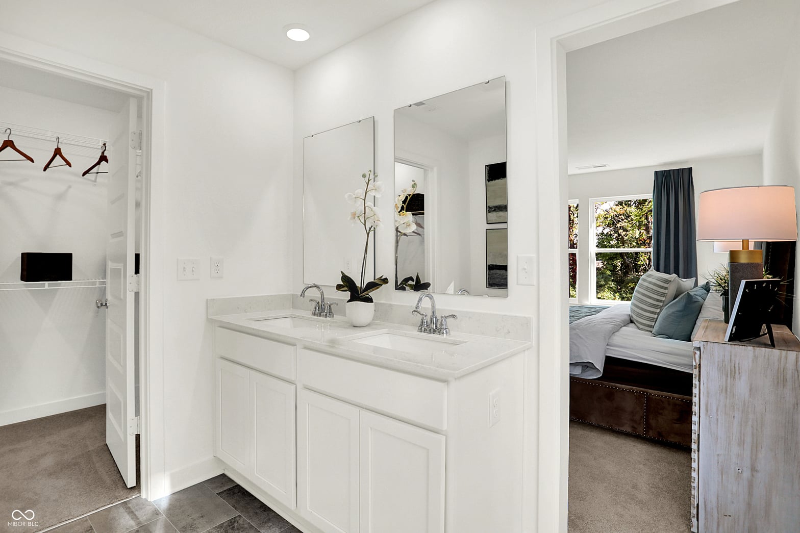 Spa-like primary bath with luxe double vanity and finishes.