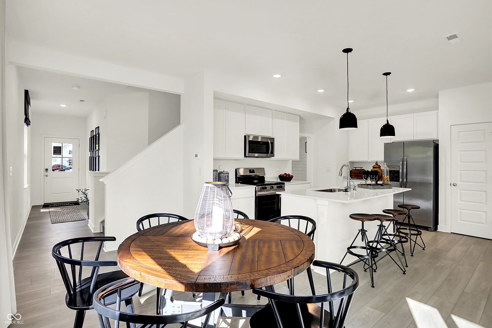 Bright modern kitchen with spacious island and dining area.