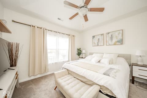 Primary bedroom at 16592 Branham Drive, Fishers, IN — Bright, serene primary bedroom with modern finishes