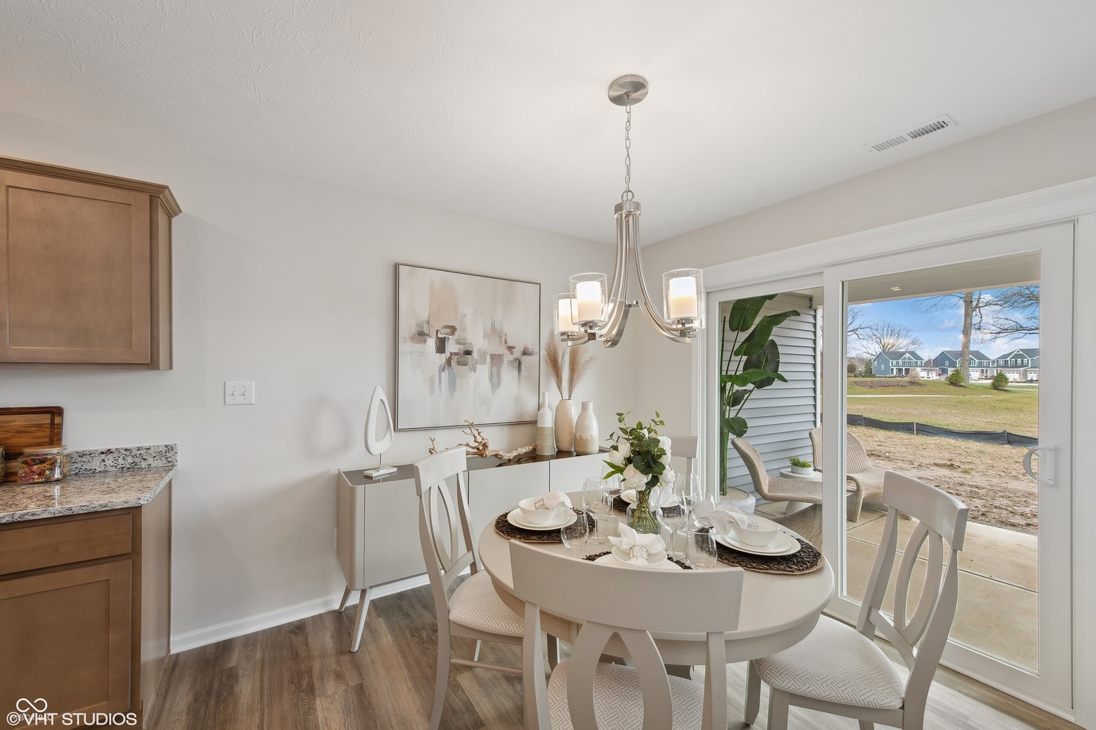 Bright dining area with glass doors and patio access.