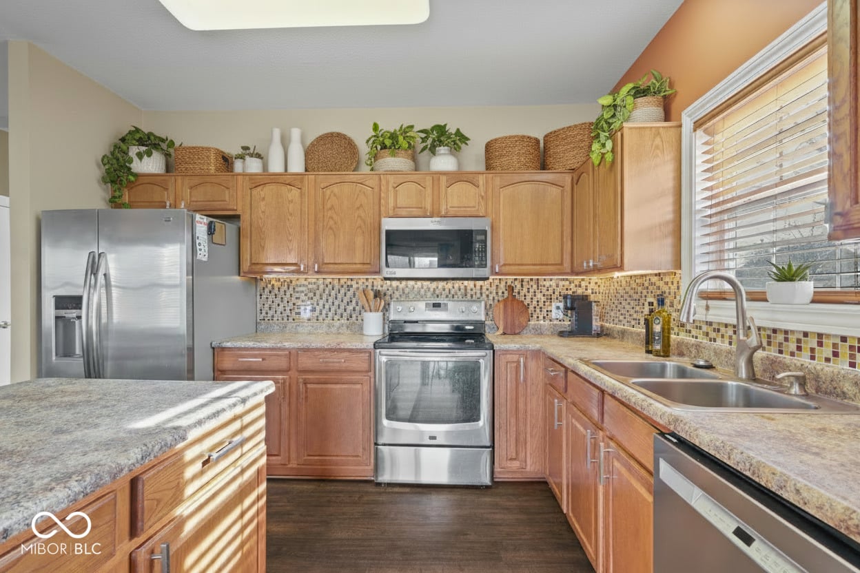 Updated kitchen with granite, stainless steel, and island.