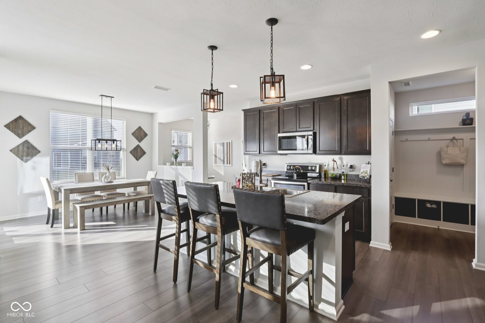 Modern kitchen with island seating and premium finishes.