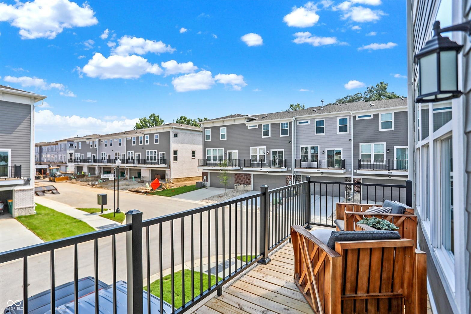 New construction townhome with contemporary deck overlooking community.