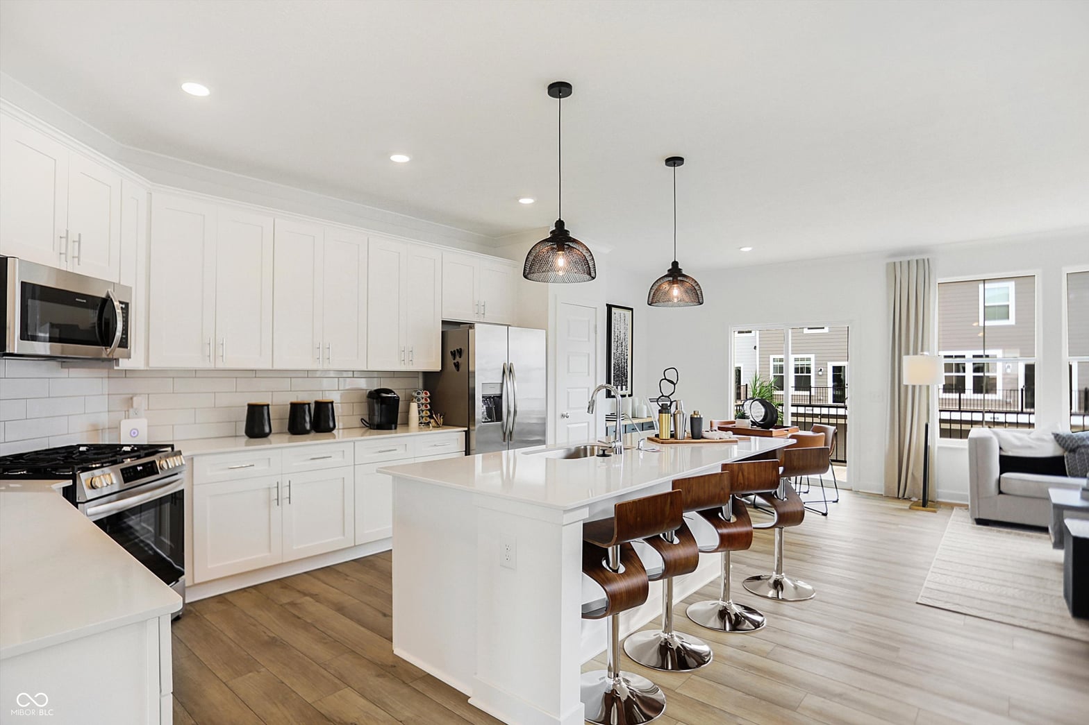 Stunning open-concept kitchen with large island and modern finishes.