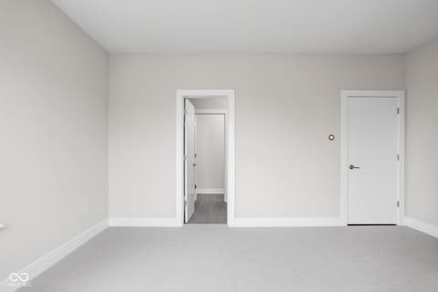 Primary bedroom at 449 Shade Street, Carmel, IN — Bright primary bedroom with ensuite bathroom access.
