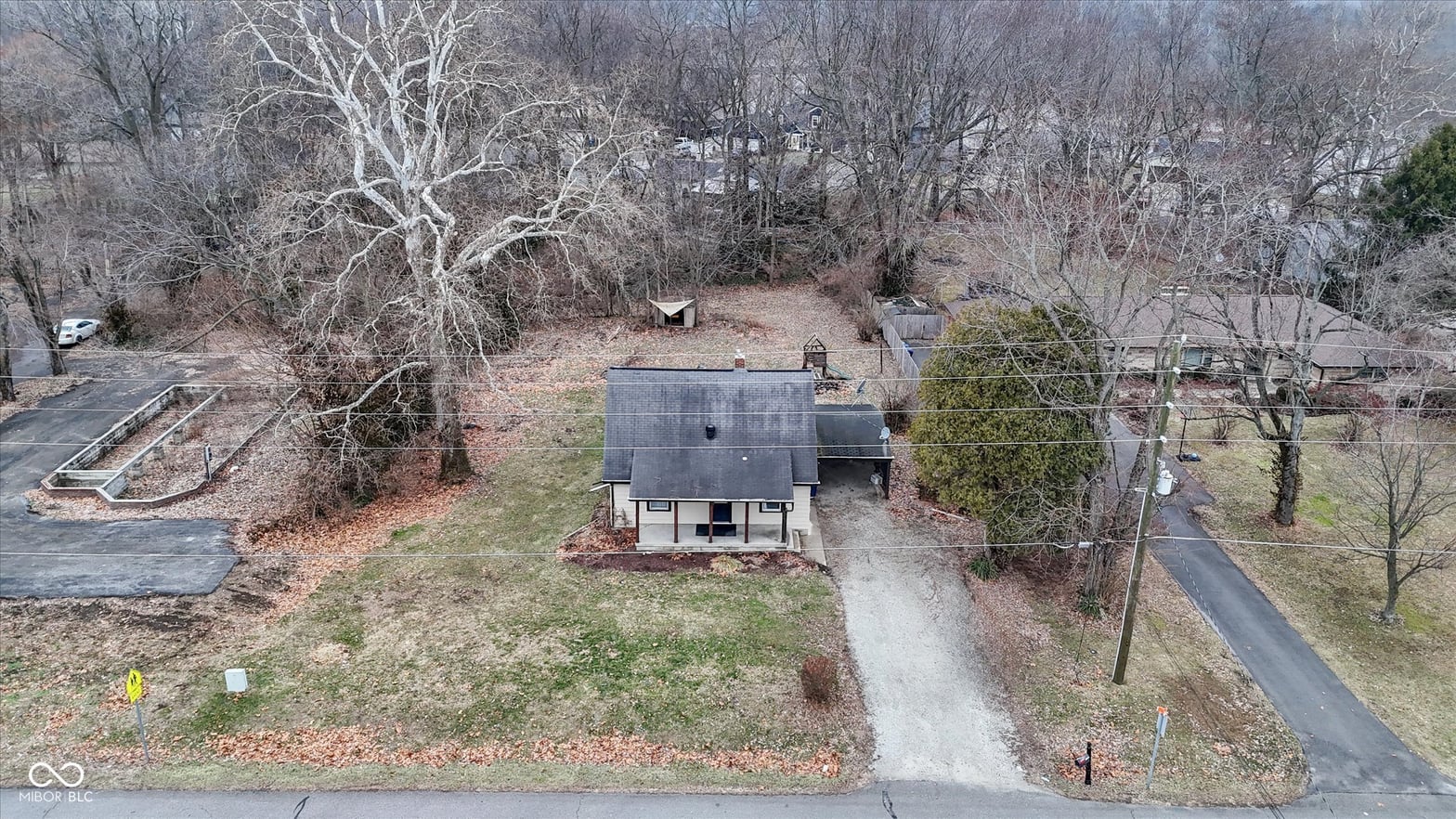 Charming home on wooded lot with established trees.