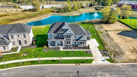 Aerial view at 1560 Old Hickory Lane, Westfield, IN — Stunning lakefront colonial on pristine grounds.
