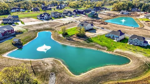 Aerial view at 1560 Old Hickory Lane, Westfield, IN — New development with resort-style community pond amenities.