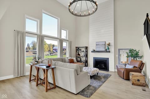 Living room at 1560 Old Hickory Lane, Westfield, IN — Bright open-concept living with soaring ceilings.