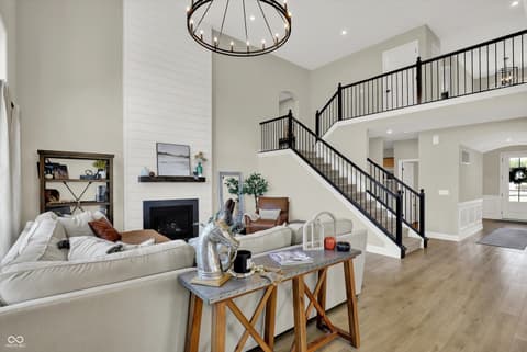 Living room at 1560 Old Hickory Lane, Westfield, IN — Bright open-concept living with soaring ceilings and loft.