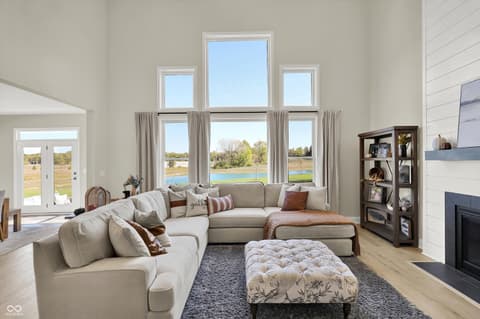 Living room at 1560 Old Hickory Lane, Westfield, IN — Bright modern living room with stunning water views.