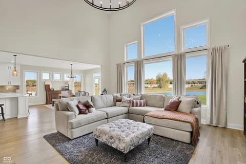 Living room at 1560 Old Hickory Lane, Westfield, IN — Bright contemporary living room with stunning water views.