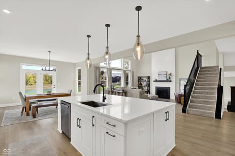 Kitchen at 1560 Old Hickory Lane, Westfield, IN — Bright modern kitchen with spacious island and pool views.