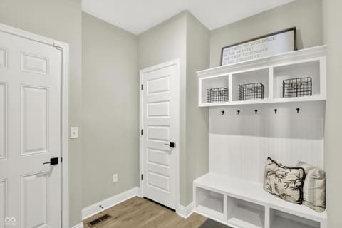 Foyer at 1560 Old Hickory Lane, Westfield, IN — Bright mudroom with custom built-in storage and seating.