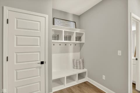 Foyer at 1560 Old Hickory Lane, Westfield, IN — Bright mudroom with custom built-in storage and seating.