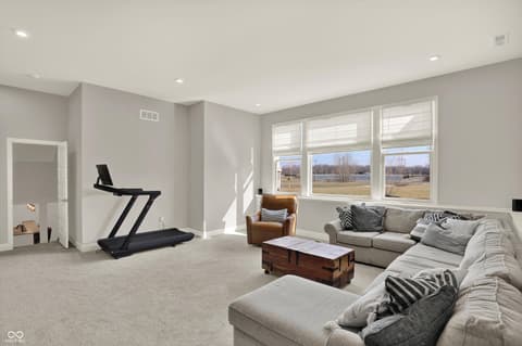Bonus room at 1560 Old Hickory Lane, Westfield, IN — Bright bonus room with expansive windows and scenic views.