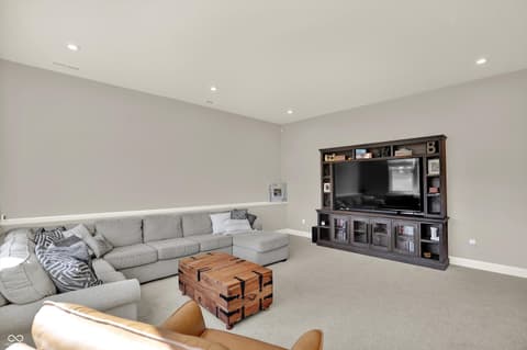 Family room at 1560 Old Hickory Lane, Westfield, IN — Spacious family room with built-in entertainment center.