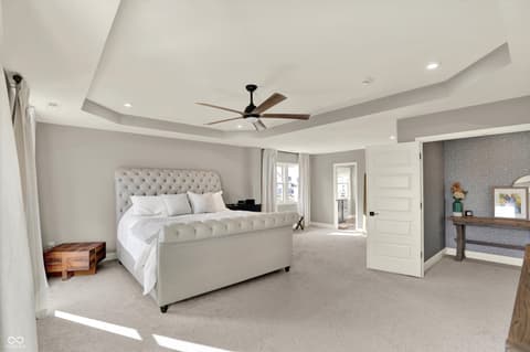 Primary bedroom at 1560 Old Hickory Lane, Westfield, IN — Spacious primary suite with coffered ceiling and ensuite.