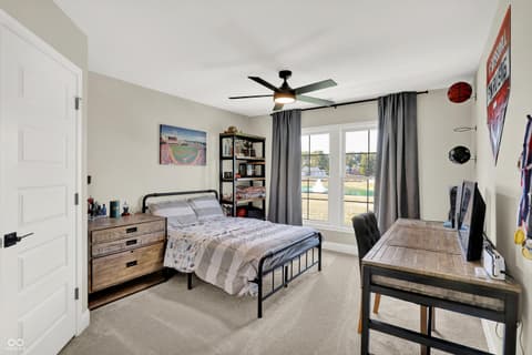 Bedroom at 1560 Old Hickory Lane, Westfield, IN — Bright bedroom with glass doors and scenic views.