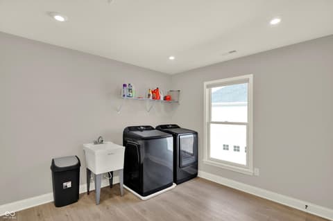 Laundry room at 1560 Old Hickory Lane, Westfield, IN — Bright, modern laundry room with premium appliances.
