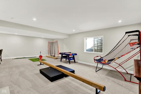 Bonus room at 1560 Old Hickory Lane, Westfield, IN — Versatile recreation room with multiple sports activities.
