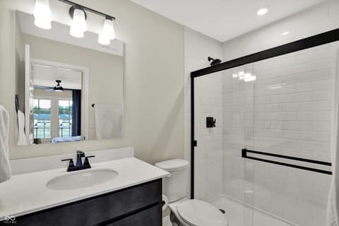 Primary bathroom at 1560 Old Hickory Lane, Westfield, IN — Stunning contemporary primary bath with luxurious finishes.
