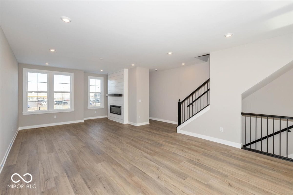 Bright modern family room with fireplace and city views.
