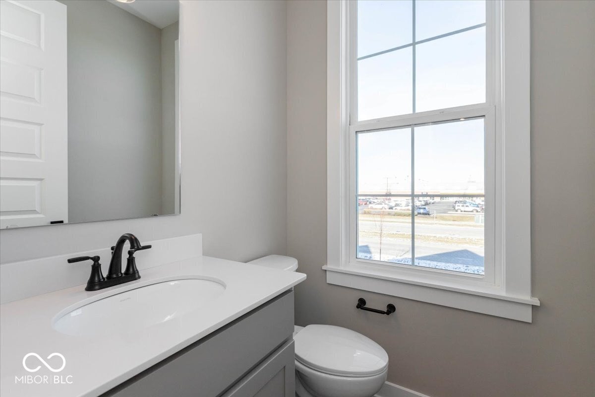 Bright, modern bathroom with expansive window views.